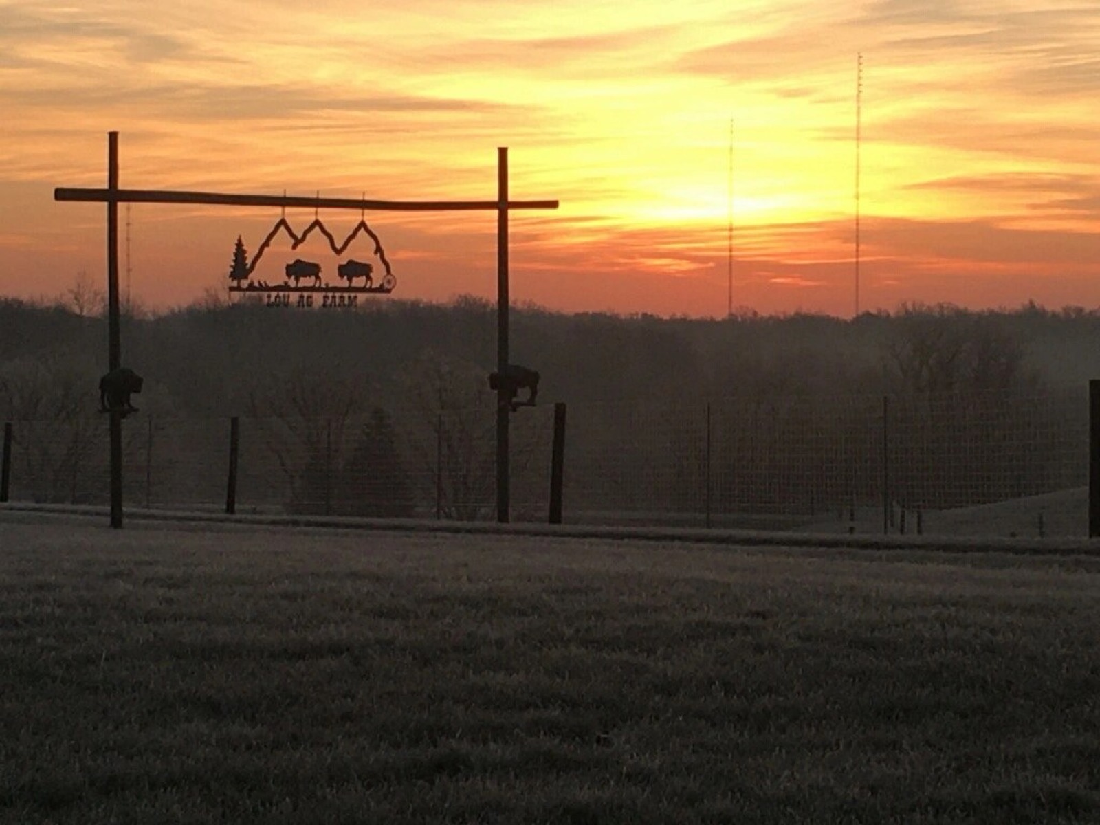 Sunrise over the LouAg Farm sign in Floyds Knobs
